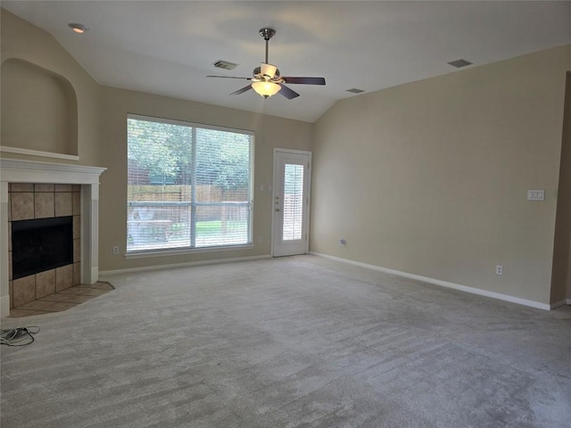1411 Hunter Ace Way, Cedar Park, TX 78613 - unfurnished living room with vaulted ceiling, ceiling fan, light carpet, and a tiled fireplace