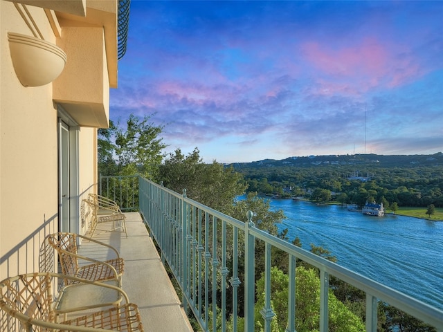3504 Mount Bonnell Rd, Austin, TX 78731 - balcony at dusk featuring a water view