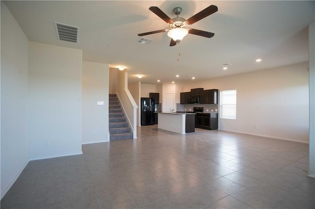 1036 Hillrose Dr, Leander, TX 78641 - unfurnished living room featuring stairs, ceiling fan, recessed lighting, baseboards, and tile patterned flooring