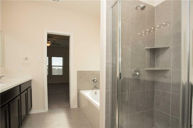 1036 Hillrose Dr, Leander, TX 78641 - bathroom featuring vanity, a shower stall, a garden tub, tile patterned flooring, and a ceiling fan
