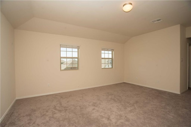 1036 Hillrose Dr, Leander, TX 78641 - empty room with vaulted ceiling, carpet floors, and baseboards