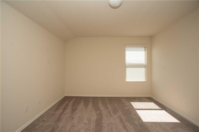 1036 Hillrose Dr, Leander, TX 78641 - empty room with dark carpet, vaulted ceiling, and baseboards