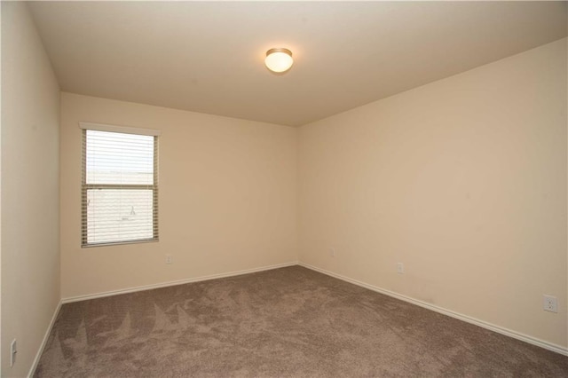 1036 Hillrose Dr, Leander, TX 78641 - empty room featuring dark carpet and baseboards