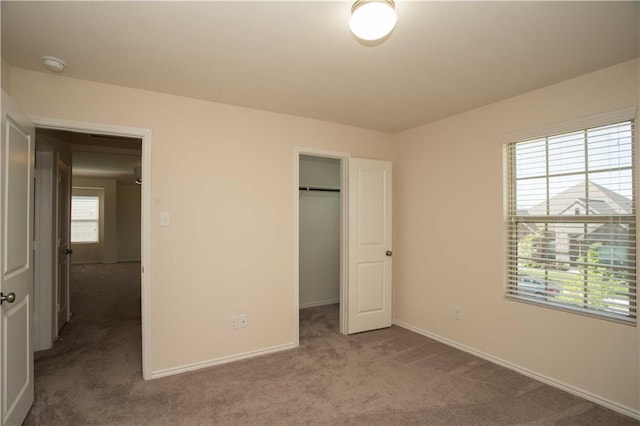 1036 Hillrose Dr, Leander, TX 78641 - unfurnished bedroom featuring carpet floors, baseboards, a spacious closet, and a closet