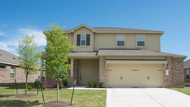 1036 Hillrose Dr, Leander, TX 78641 - traditional-style house featuring a garage, concrete driveway, stucco siding, and a front lawn