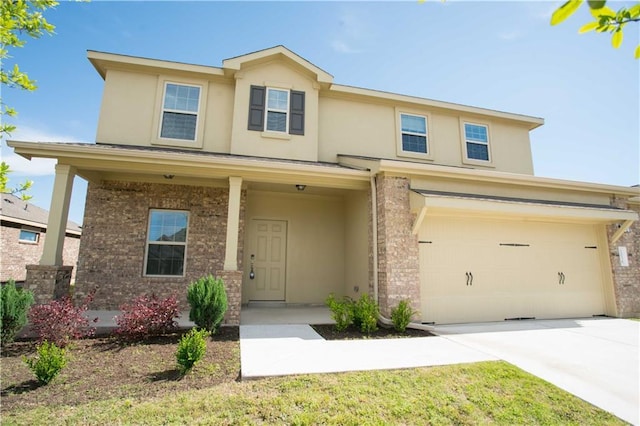 1036 Hillrose Dr, Leander, TX 78641 - traditional home featuring a garage, stucco siding, driveway, and brick siding