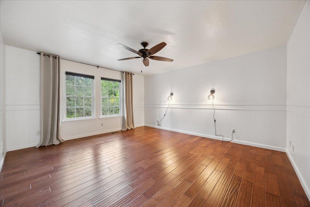 11900 Tunnel Trl, Manchaca, TX 78652 - unfurnished room featuring ceiling fan, baseboards, and wood finished floors