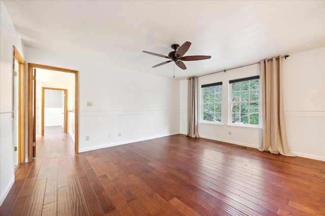 11900 Tunnel Trl, Manchaca, TX 78652 - spare room featuring dark wood-type flooring, ceiling fan, and baseboards
