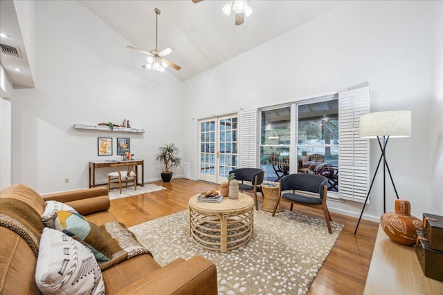11900 Tunnel Trl, Manchaca, TX 78652 - living area with wood finished floors, ceiling fan, high vaulted ceiling, and baseboards