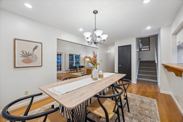 11900 Tunnel Trl, Manchaca, TX 78652 - dining area with a chandelier, wood finished floors, stairway, baseboards, and recessed lighting