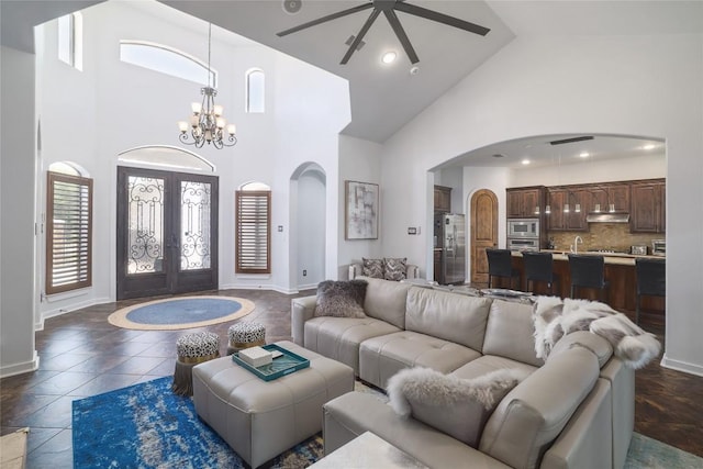 15203 Lariat Trl, Austin, TX 78734 - living area with high vaulted ceiling, arched walkways, a chandelier, french doors, and ceiling fan