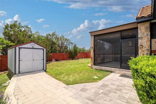 15203 Lariat Trl, Austin, TX 78734 - fenced backyard with a sunroom, a storage unit, and a patio