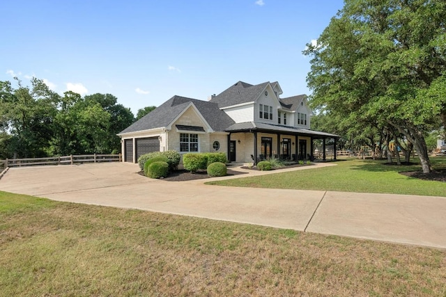 140 Vincas Shadow Ct, Driftwood, TX 78619 - view of front of property featuring a porch, an attached garage, and driveway