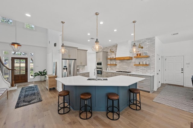 140 Vincas Shadow Ct, Driftwood, TX 78619 - kitchen featuring open shelves, custom range hood, a kitchen breakfast bar, stainless steel appliances, and recessed lighting