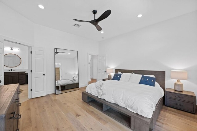 140 Vincas Shadow Ct, Driftwood, TX 78619 - bedroom featuring light wood-style floors, ensuite bath, recessed lighting, a ceiling fan, and a sink