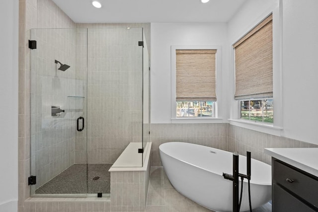 140 Vincas Shadow Ct, Driftwood, TX 78619 - bathroom with a freestanding tub, a shower stall, tile walls, vanity, and recessed lighting