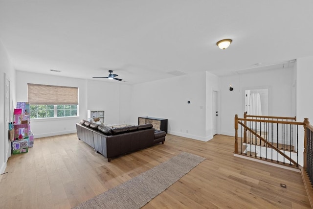 140 Vincas Shadow Ct, Driftwood, TX 78619 - living area featuring attic access, a ceiling fan, light wood finished floors, and baseboards