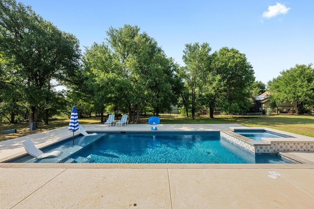 140 Vincas Shadow Ct, Driftwood, TX 78619 - view of pool with a patio area, a pool with connected hot tub, and view of wooded area