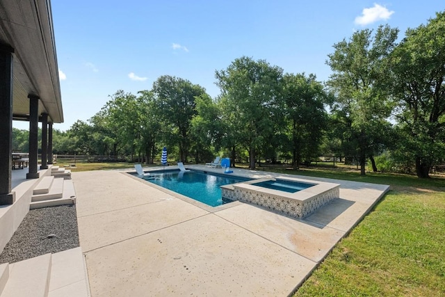 140 Vincas Shadow Ct, Driftwood, TX 78619 - view of swimming pool featuring a patio, a yard, view of scattered trees, and a pool with connected hot tub