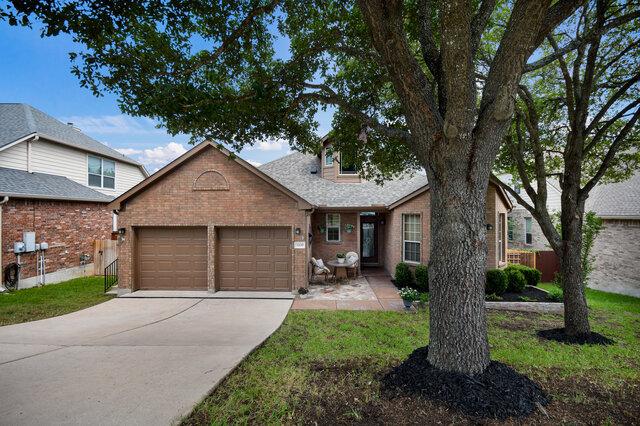 3200 Argento Pl, Cedar Park, TX 78613 - view of front of property featuring a garage, brick siding, and concrete driveway