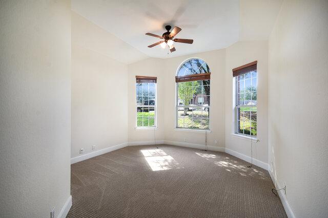 3200 Argento Pl, Cedar Park, TX 78613 - carpeted spare room featuring baseboards, ceiling fan, and vaulted ceiling