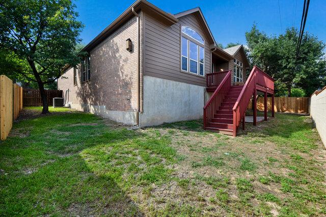 3200 Argento Pl, Cedar Park, TX 78613 - rear view of house featuring stairway, a deck, cooling unit, and brick siding