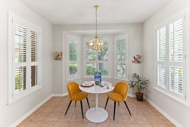 103 Winecup Way, Georgetown, TX 78633 - dining area featuring plenty of natural light, a chandelier, baseboards, and light tile patterned floors