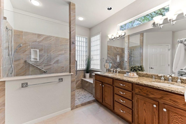 103 Winecup Way, Georgetown, TX 78633 - full bathroom with a walk in shower, double vanity, and tile patterned floors