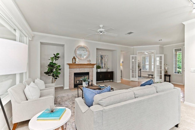 103 Winecup Way, Georgetown, TX 78633 - living room with baseboards, a ceiling fan, a fireplace, and ornamental molding