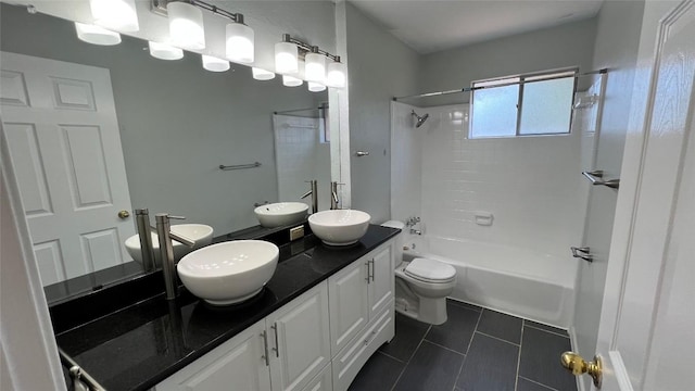 3307 Whitepine Dr, Austin, TX 78757 - bathroom with tile patterned flooring, toilet, washtub / shower combination, and double vanity