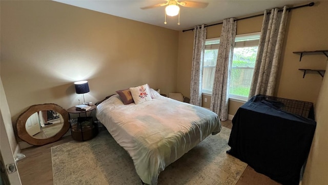 3307 Whitepine Dr, Austin, TX 78757 - bedroom with light wood finished floors and ceiling fan