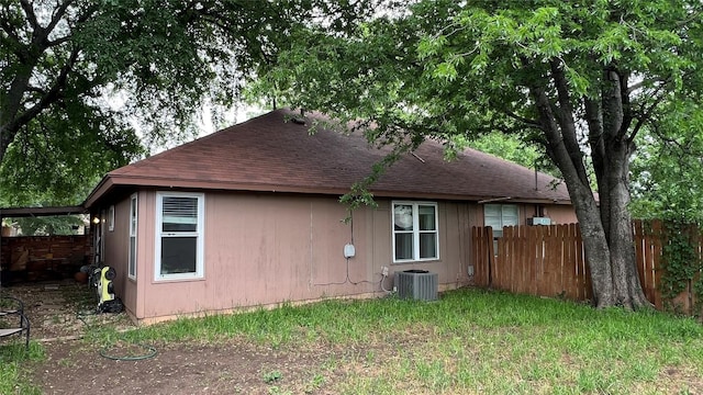 3307 Whitepine Dr, Austin, TX 78757 - rear view of house featuring roof with shingles and cooling unit