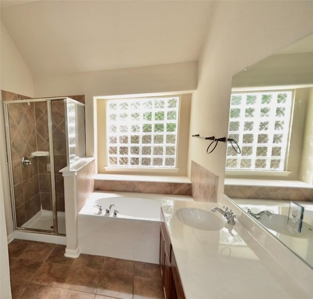 12609 Lee Park Ln, Austin, TX 78732 - full bathroom with a garden tub, vanity, a stall shower, tile patterned flooring, and lofted ceiling