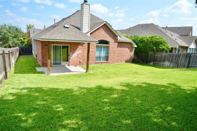 12609 Lee Park Ln, Austin, TX 78732 - back of house featuring brick siding, a patio, roof with shingles, and a chimney