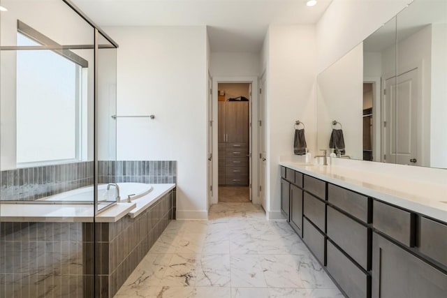 2905 Canto Trce, Leander, TX 78641 - full bath with a bath, marble look tiles, double vanity, and a walk in closet