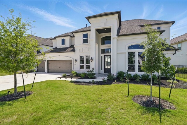 2905 Canto Trce, Leander, TX 78641 - view of front facade featuring stucco siding, driveway, and roof with shingles