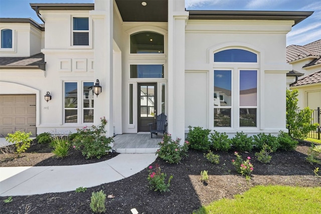 2905 Canto Trce, Leander, TX 78641 - property entrance with stucco siding, a porch, and a garage