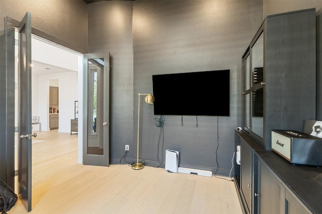 2905 Canto Trce, Leander, TX 78641 - living area featuring light wood-type flooring and baseboards
