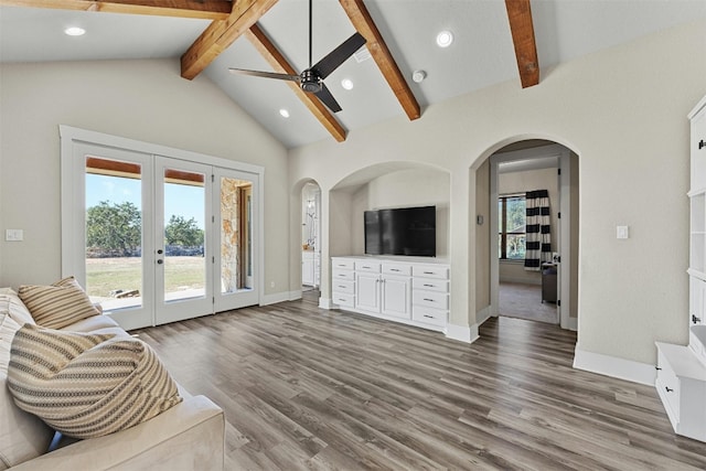 101 Aldea St, Georgetown, TX 78633 - unfurnished living room featuring a ceiling fan, french doors, wood finished floors, recessed lighting, and arched walkways