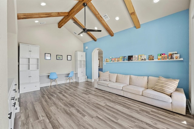 101 Aldea St, Georgetown, TX 78633 - living room featuring beam ceiling, arched walkways, wood finished floors, high vaulted ceiling, and a ceiling fan