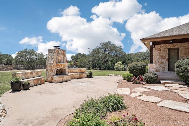 101 Aldea St, Georgetown, TX 78633 - view of patio with an outdoor stone fireplace