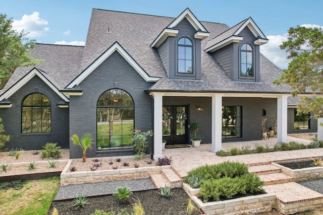 400 Goodnight Trl, Dripping Springs, TX 78620 - view of front of home with roof with shingles and brick siding