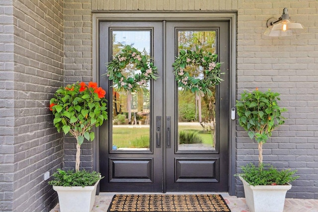 400 Goodnight Trl, Dripping Springs, TX 78620 - entrance to property featuring french doors, brick siding, and a ceiling fan