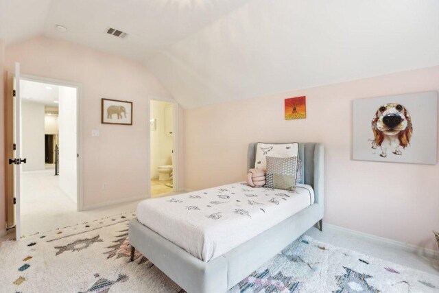 400 Goodnight Trl, Dripping Springs, TX 78620 - carpeted bedroom with lofted ceiling, baseboards, and ensuite bath