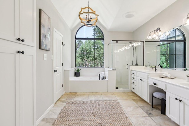 400 Goodnight Trl, Dripping Springs, TX 78620 - bathroom with a chandelier, a shower stall, a garden tub, double vanity, and lofted ceiling