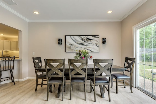 3002 Stardust Dr, Austin, TX 78757 - dining space with light wood-type flooring, recessed lighting, crown molding, and baseboards