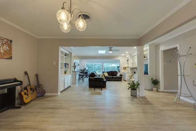 3002 Stardust Dr, Austin, TX 78757 - living room featuring light wood-style floors, a ceiling fan, ornamental molding, baseboards, and a chandelier