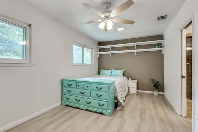 3002 Stardust Dr, Austin, TX 78757 - bedroom with light wood-style floors, baseboards, and ceiling fan