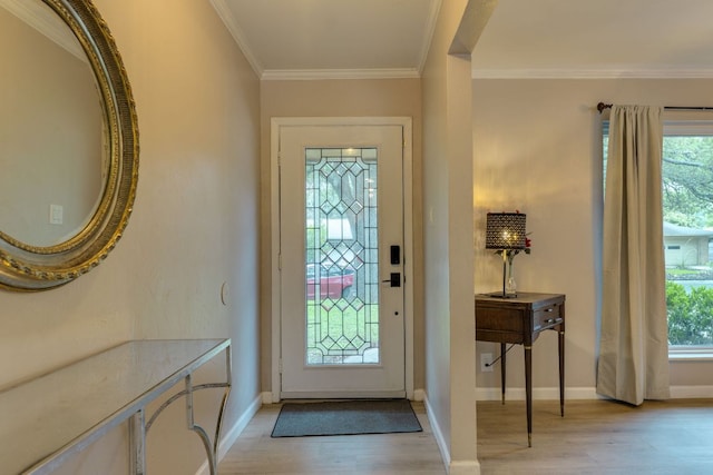 3002 Stardust Dr, Austin, TX 78757 - entryway featuring light wood-style floors, plenty of natural light, crown molding, and baseboards