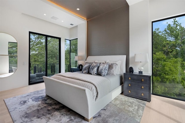 1115 Gillespie Pl, Austin, TX 78704 - bedroom featuring access to exterior and wood finished floors